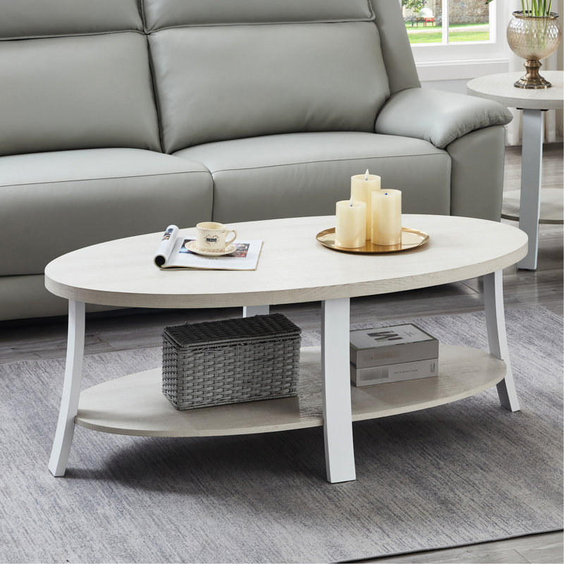 Élégante table basse ovale avec tablette en bois blanc pratique
