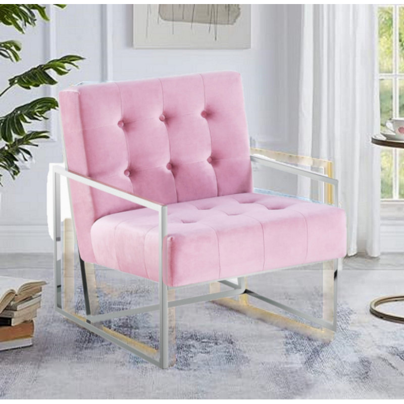Luxueux fauteuil capitonné en velours avec structure en acier inoxydable chromé, parfait pour les salons modernes et élégants.