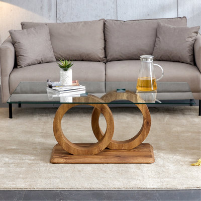 Une table basse rectangulaire moderne et tendance avec un plateau en verre trempé et des pieds en grain de bois. Convient au salon: 47,2 po x 25,4 po x 17,9 po
