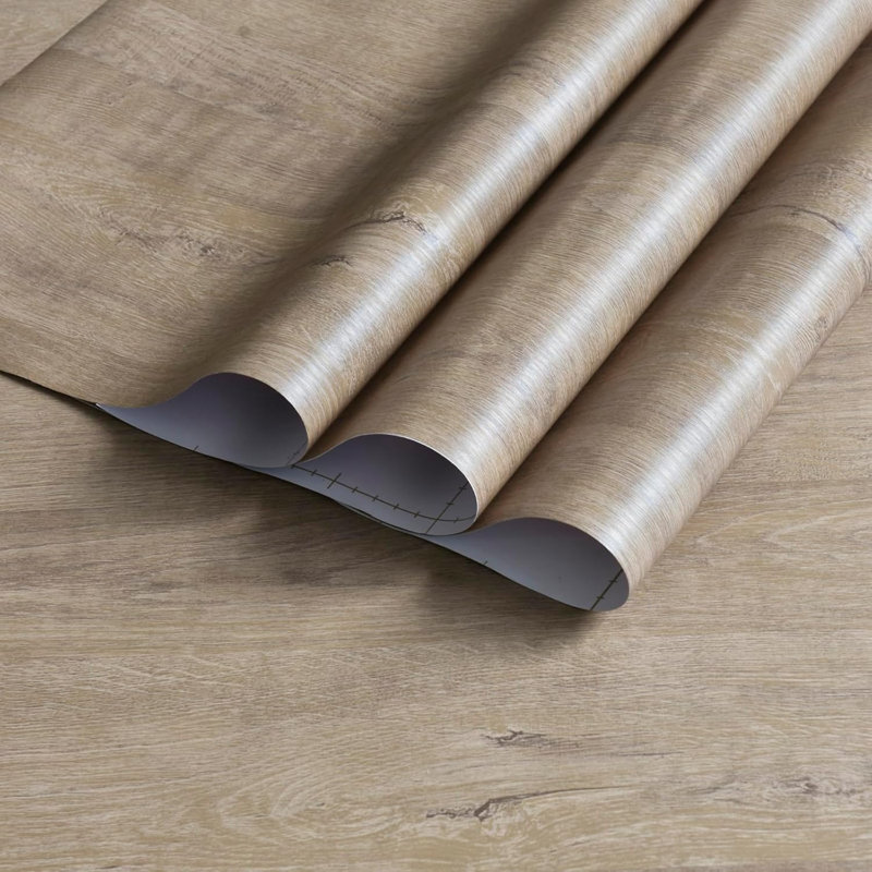 Papier peint auto-adhésif avec grain de bois, pellicule de vinyle imperméable, technologie de fente de guidage d'air, finition mate pour une application facile et adhérence durable