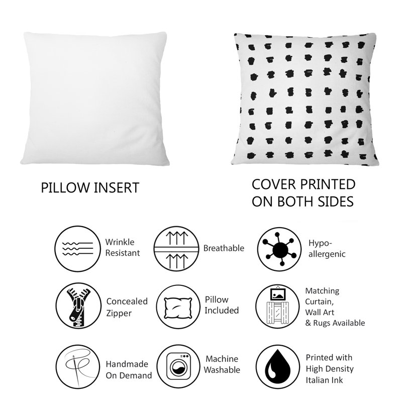 Coussin décoratif à motif géométrique à pois noirs sur fond blanc