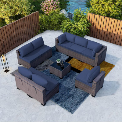 Yasmina 9-Piece Rattan Sectional Seating Group with Cushions And Tempered Glass Table