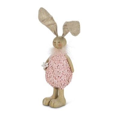 Figurine de lapin portant des fleurs debout