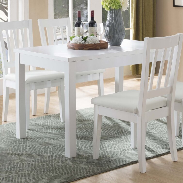 https://assets.wfcdn.com/im/58747327/resize-h755-w755%5Ecompr-r85/1409/140926976/Caparrelli+Extendable+Dining+Table.jpg