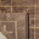 Tibetan Plum Pictogram Brown Area Rug