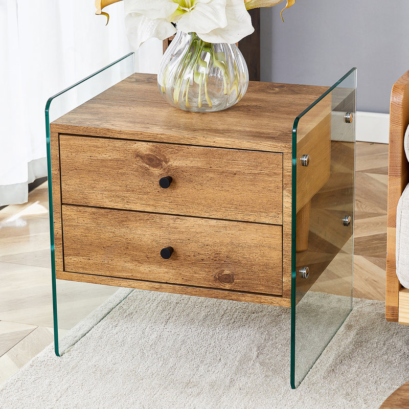 Double-drawer bedside table. The board surface is MDF with wood grain sticker, and both sides are transparent tempered glass. The design is simple and elegant, with excellent storage functions.