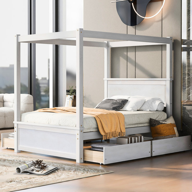 Le lit à baldaquin avec tête de lit complète et tout confort en blanc crée un environnement de sommeil paisible