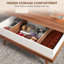 Table basse à plateau relevable avec compartiments cachés et pieds en bois, noyer