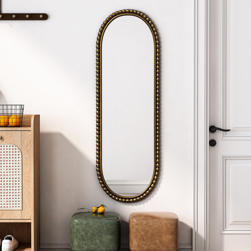 Miroir ovale en fer doré