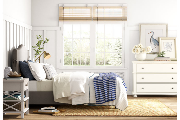 New England coastal-style bedroom with white and navy blue color scheme