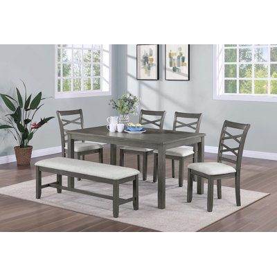 Ensemble de salle à manger 6 pièces avec table rectangulaire, quatre chaises et un banc, combinant charme moderne et sièges confortables pour les repas de famille et les réceptions