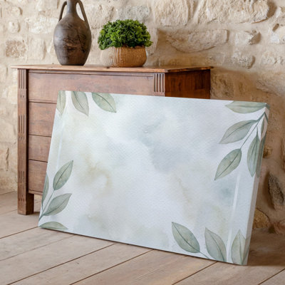 Canvas A Serene And Minimalist Design Featuring Soft Muted Green Leaves Wall Art Gracefully Positioned In The Corners Of A Light Canvas Wall Art