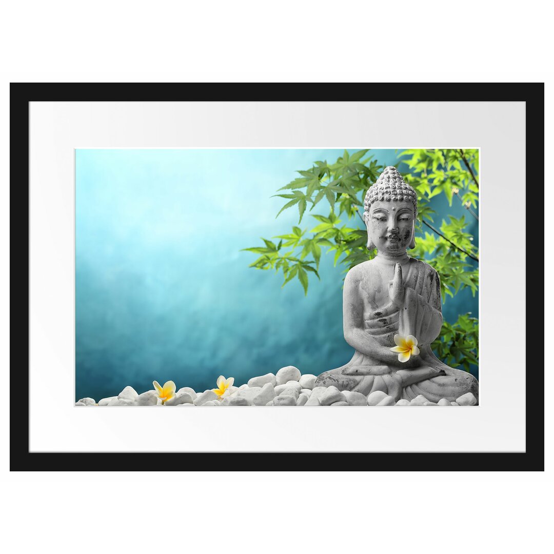 Gerahmtes Poster Buddha auf Steinen mit Monoi Blüte