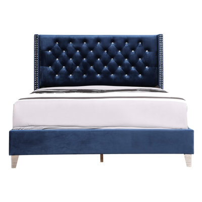 Lit rembourré relaxant bleu marine avec support lombaire au design élégant