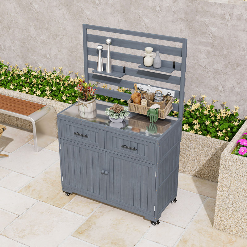 Îlot de cuisine en bois avec plateau, armoire et tiroirs en acier inoxydable