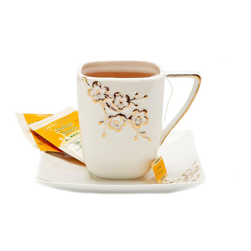 Plateau carré blanc et tasse avec motif floral doré