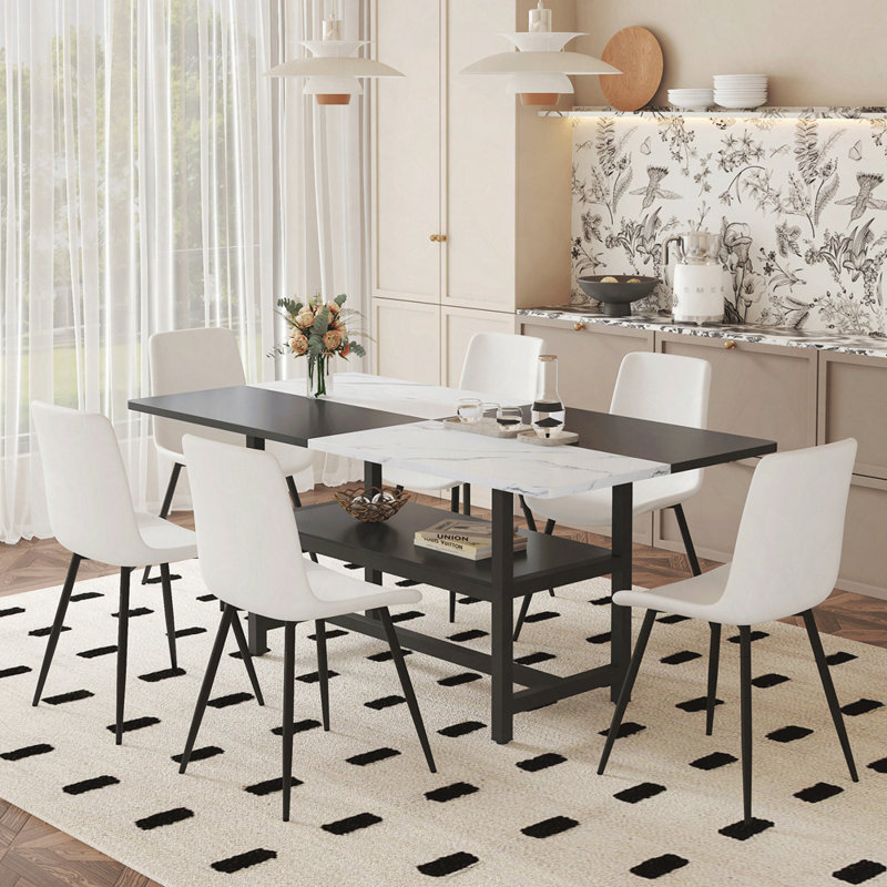Table and chair set.71*35.4 inch White And Black Spliced Dining Table With Storage Function In The Middle Of The Table Legs.Paired With Artificial PU Chairs With Curved Widened Cushion Design