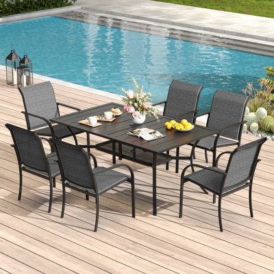 Cihangir Rectangular 6 - Person 60'' L Outdoor Patio Dining Set with 6 Stackable Textilene Armrest Chairs