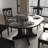 X43" farmhouse expandable oval dining table: black trestle x-shaped base, removable leaf for flexible seating