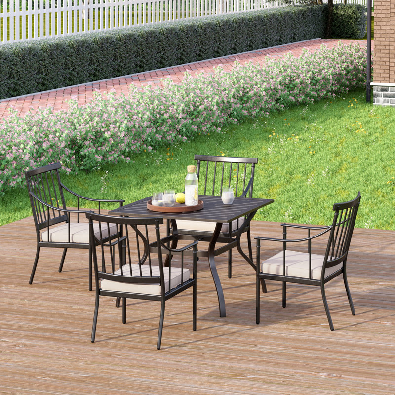 Arlane 4 - Person Stainless Steel Patio Dining Set Umbrella Hole Included Square Table with Cushions Included