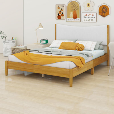 Lit en bois avec tête de lit tapissier