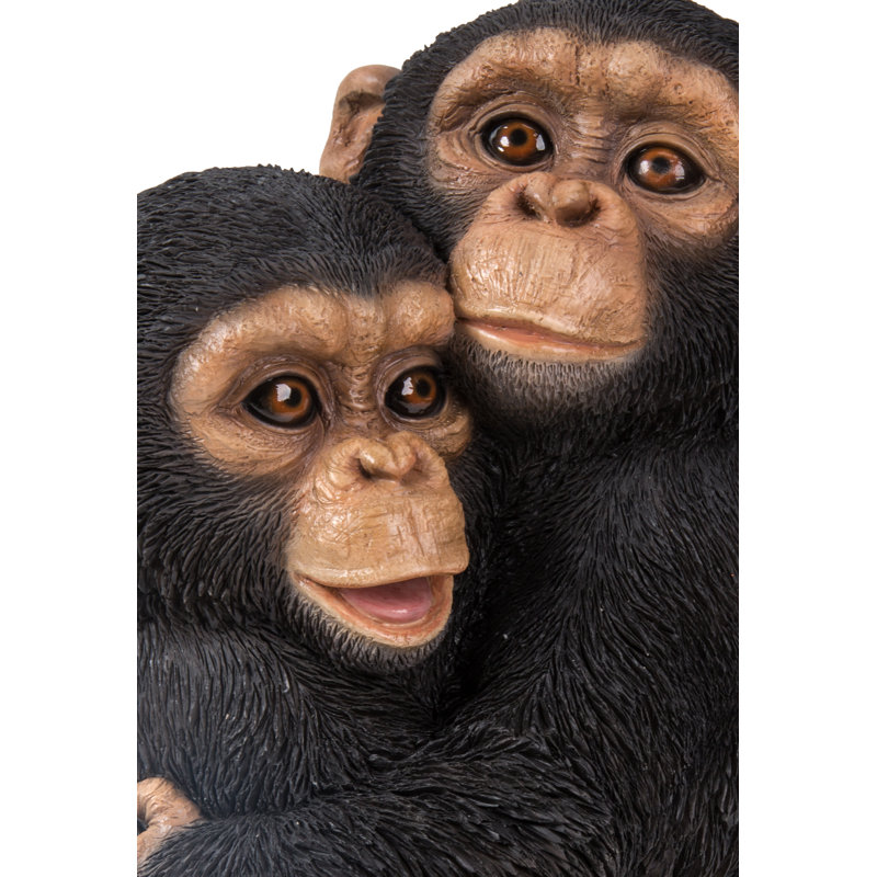 Chimpanzees Hugging Statue