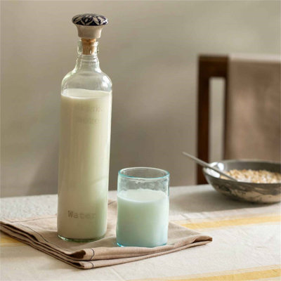 Elegant Glass Water Bottle with Ceramic Stopper - 750ML, Perfect for Daily Hydration and Kitchen Display.