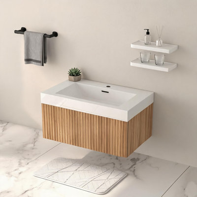 Meuble-lavabo mural flottant avec lavabo intégré. Fabriqué en placage de contreplaqué dans des tons de bois d'acacia, il adopte un style minimaliste moderne et s'adapte bien aux salles de bain compactes.