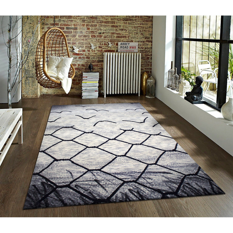 Tapis géométrique noir / gris / blanc à motif géométrique touffeté à la machine 4 pi 11 po x 7 pi 8 po