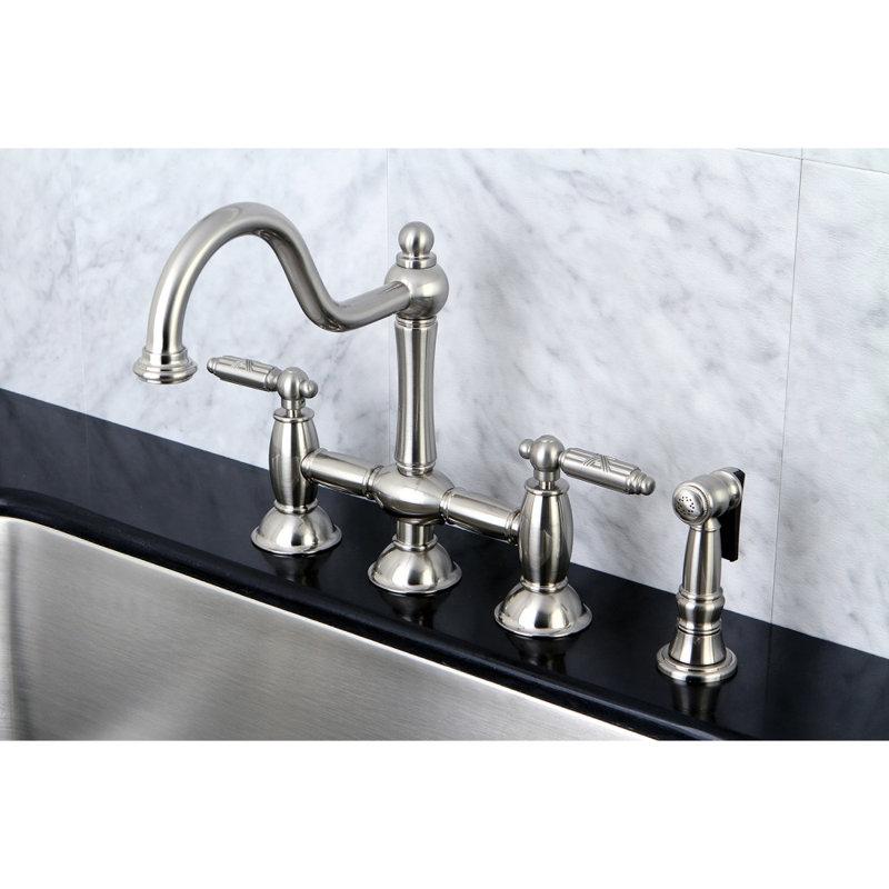 Kingston Brass Restoration Two-Handle 4-Hole Deck Mount Bridge Kitchen Faucet with Brass Side Sprayer
