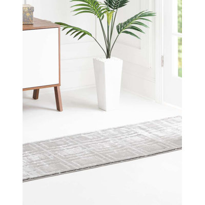 Tapis gris argenté à motif géométrique glam