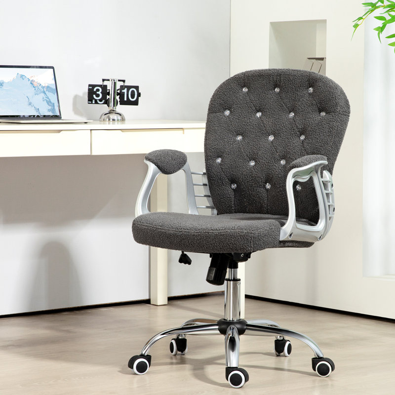 Équipement de bureau en molleton gris foncé avec boutons, hauteur réglable et roulettes pivotantes pour une chaise de bureau gris professionnel, matériau, confort accru
