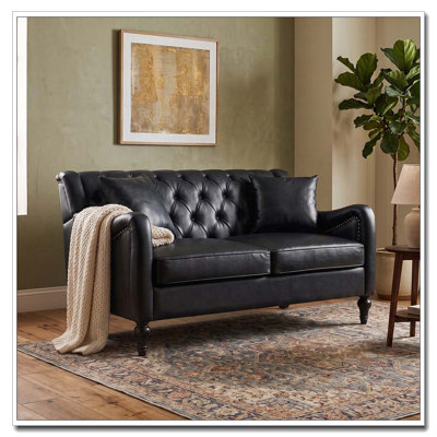 Sofa deux places en similicuir avec dossier capitonné et garniture cloutée