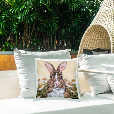 Coussin d'extérieur imprimé lapin avec des marguerites