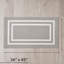 Tapis gris clair / blanc à double bordure touffeté à la machine-64089942