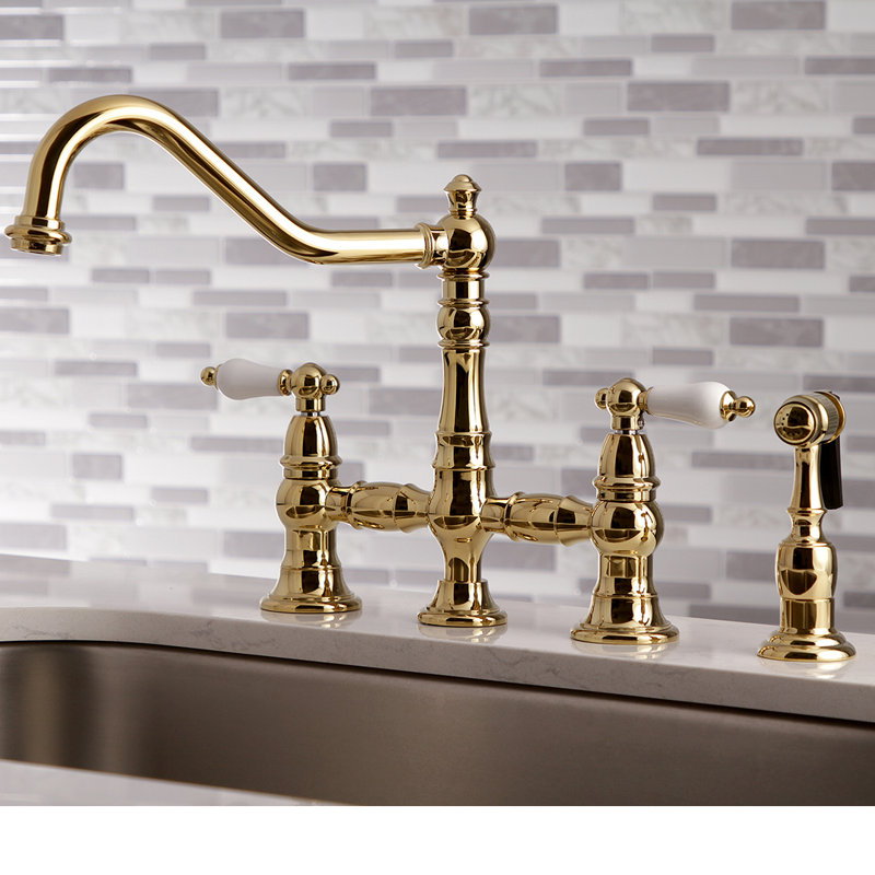 Kingston Brass Restoration Two-Handle 4-Hole Deck Mount Bridge Kitchen Faucet with Brass Side Sprayer, Polished Brass