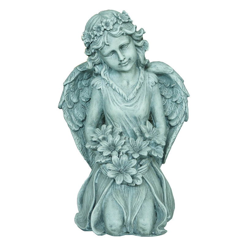 Statue ange a genou tenant des fleurs