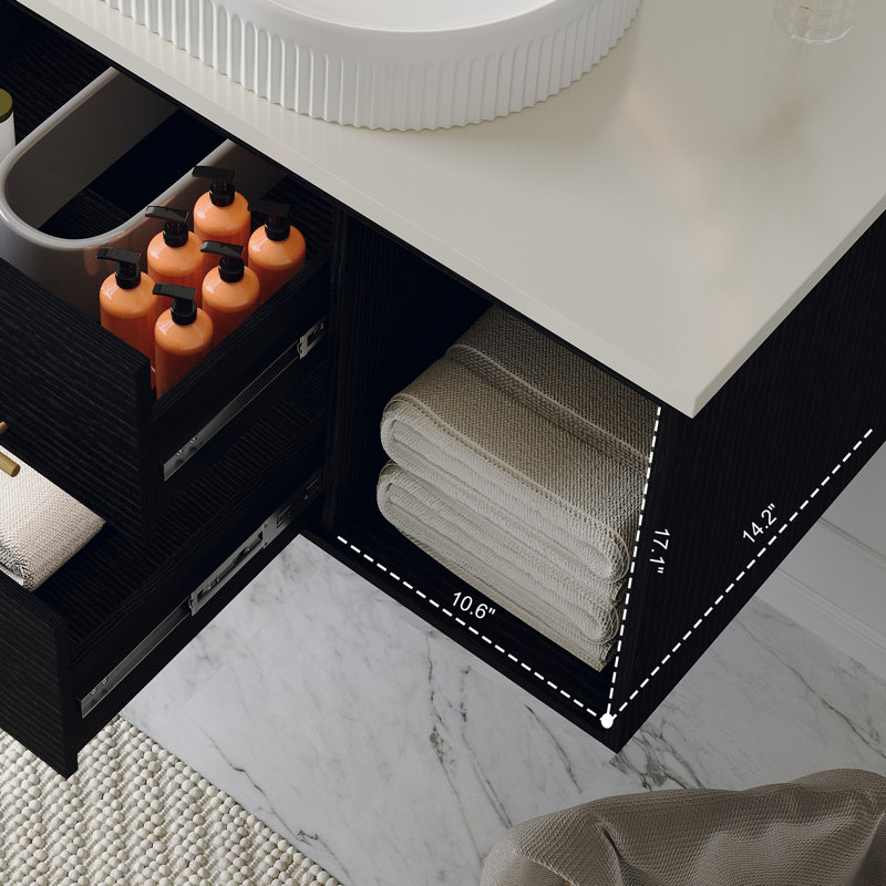 Meuble-lavabo moderne avec lavabo ovale en céramique, finition murale noire et dorée, solution de salle de bain compacte