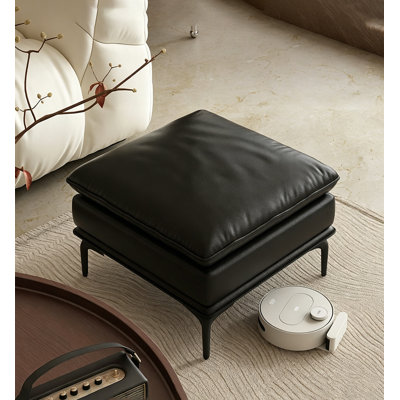 Repose-pieds en cuir noir avec repose-pieds