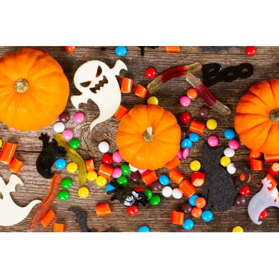 Halloween candies on wood 1 Piece Wrapped Canvas Wall Art