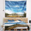 Tapisserie bord de mer et lac sous un ciel bleu-28507399