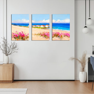 Tableau sur toile représentant une scène de plage avec des fleurs roses et des maisons côtières (lot de 3)