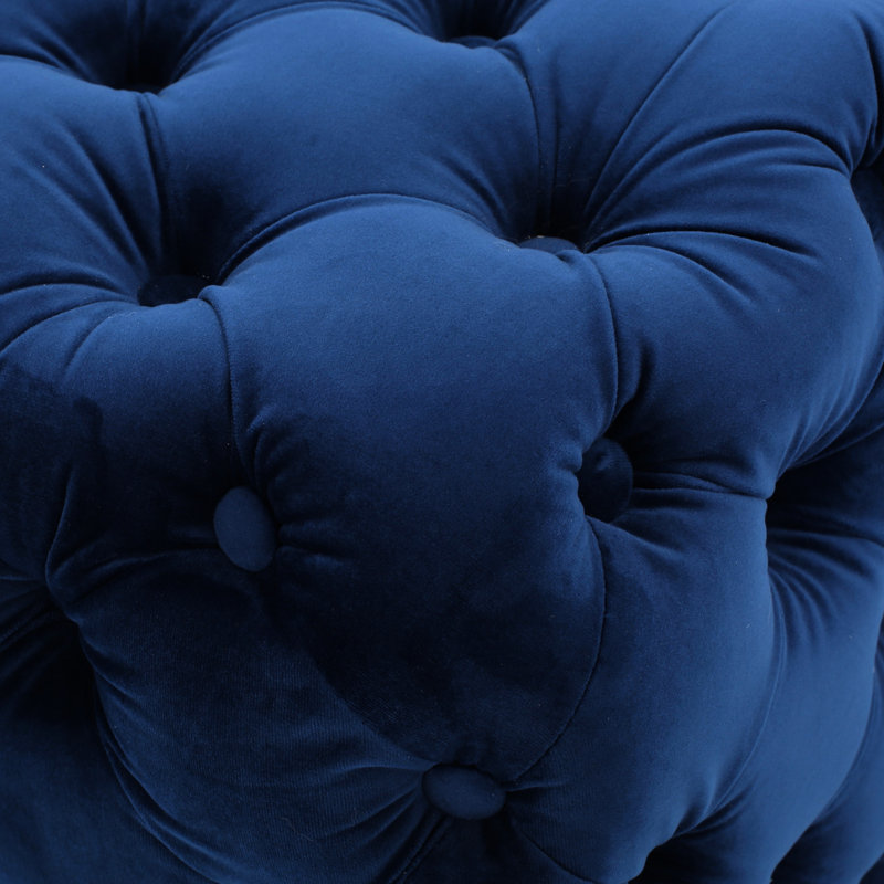 Surface moderne en velours bleu marine avec boutons capitonnés