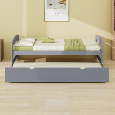 Lit plateforme peu encombrant avec lit gigogne et support en lattes de bois robuste