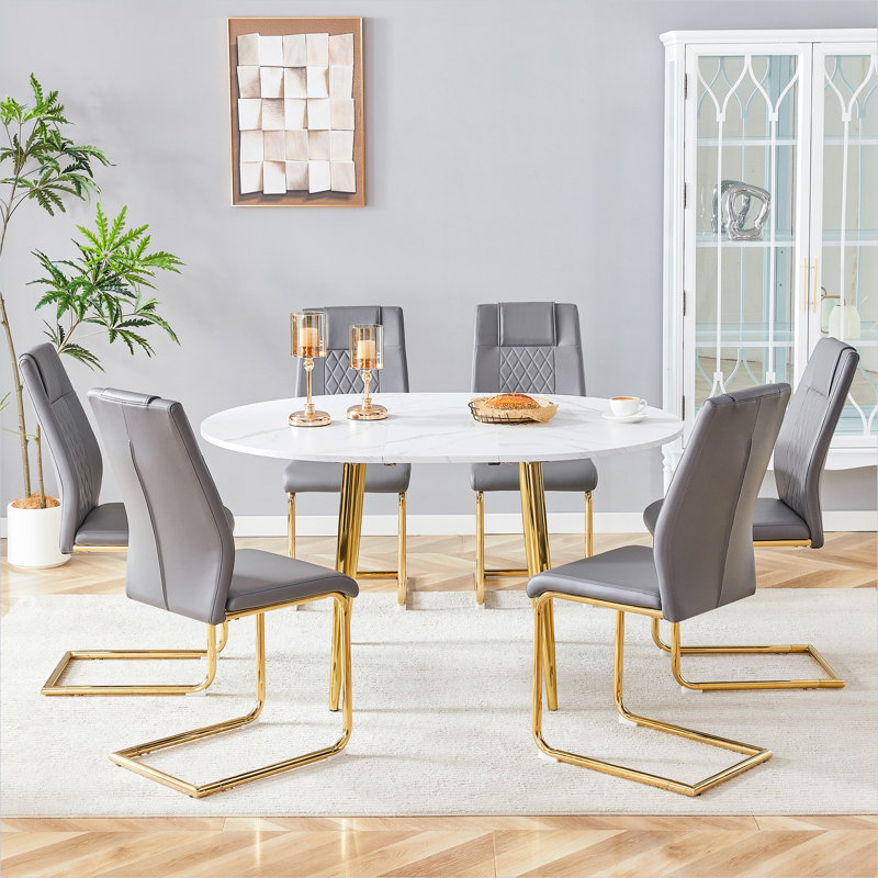 Ensemble de salle à manger rond extensible pour 6 personnes avec chaises gris neutre et table en bois aggloméré blanc, pieds en métal doré