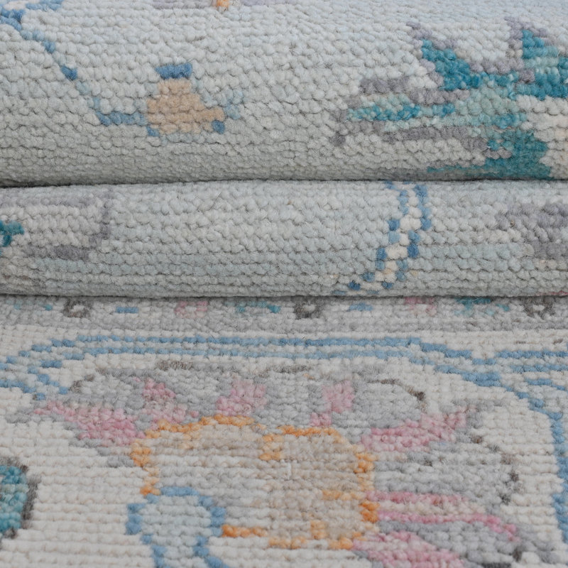 Tapis bleu et ivoire de haute qualité noué à la main