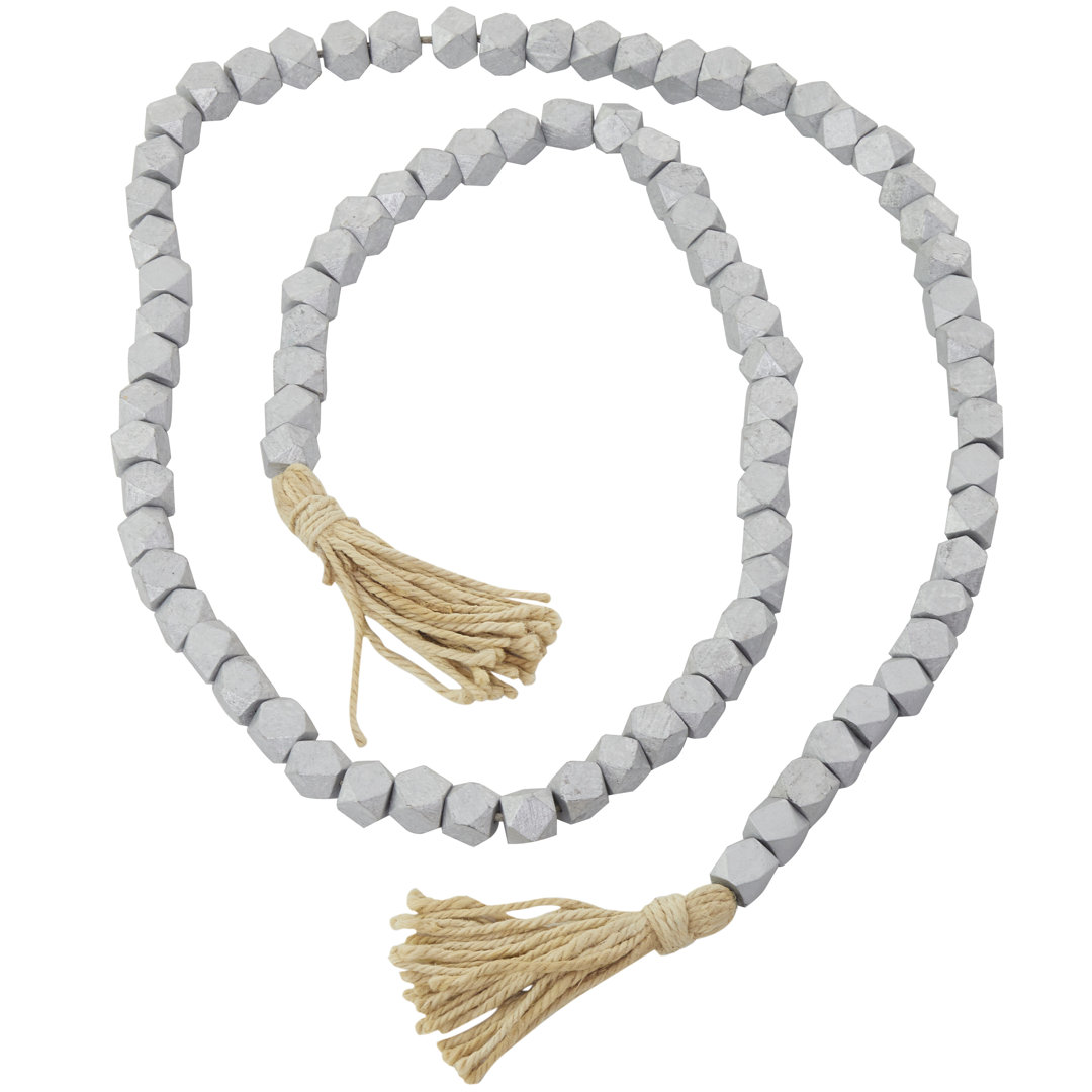 Mango Wood Handmade Hexagon Carved Geometric Long Beaded Garland with Tassel Bungalow Rose 