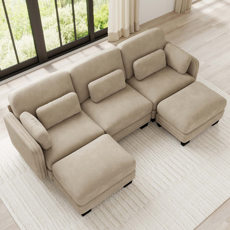 Canapé d'angle modulaire capitonné avec poufs amovibles