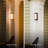 12W LED Integrated Matte Black Outdoor Wall Sconce with Frosted Glass