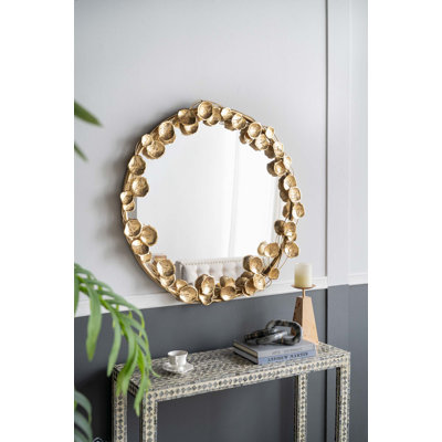 Miroir mural rond en métal avec détails dorés